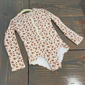 Garden being rylee and Cru rash guard swim suit. 6-7 years